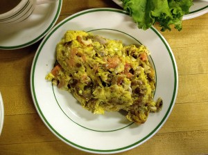 Photograph of plate of eggs with sturgeon, salmon and onions